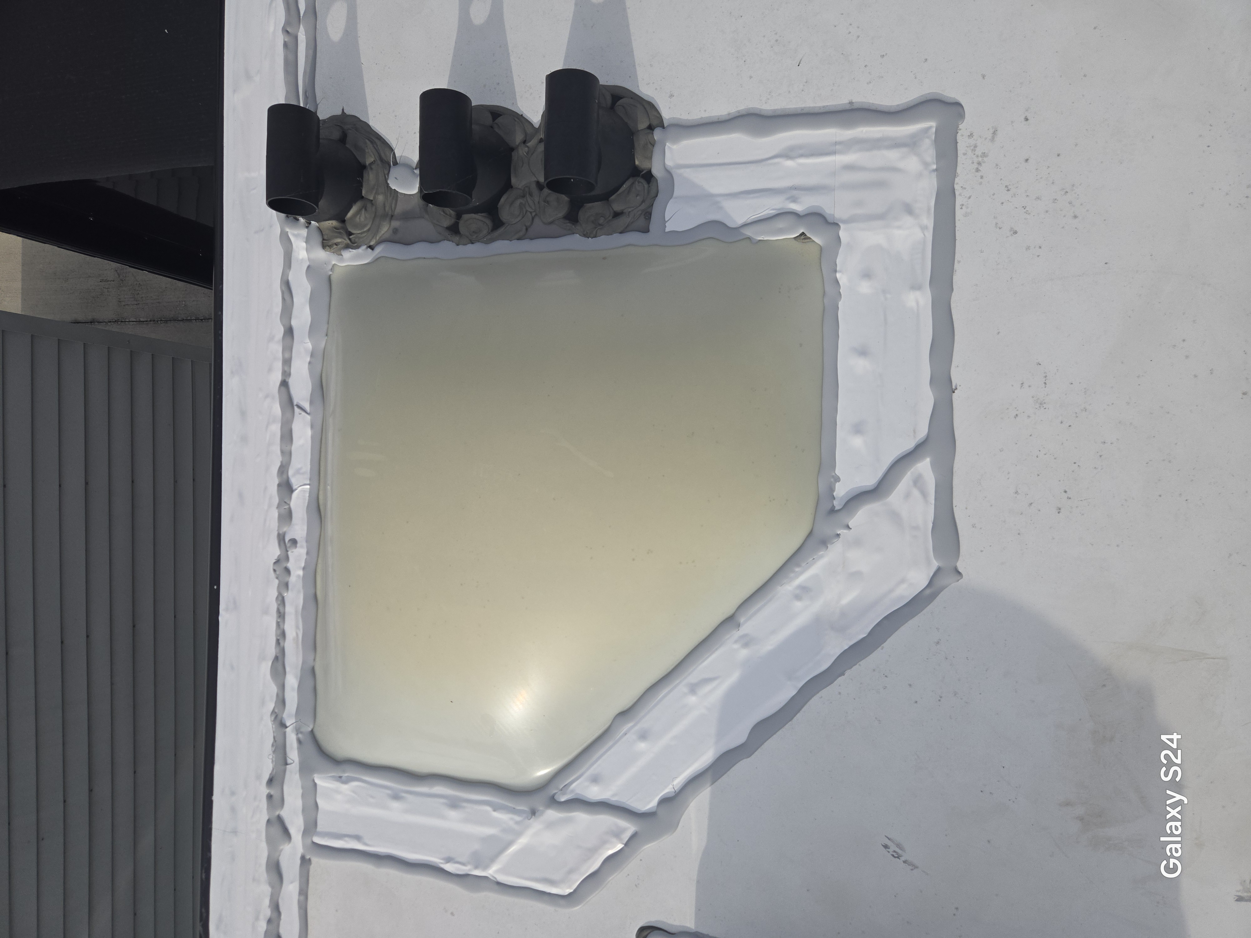 Fresh roof sealant applied around an RV roof vent by Rudy's RV Repair in Sarasota, Florida