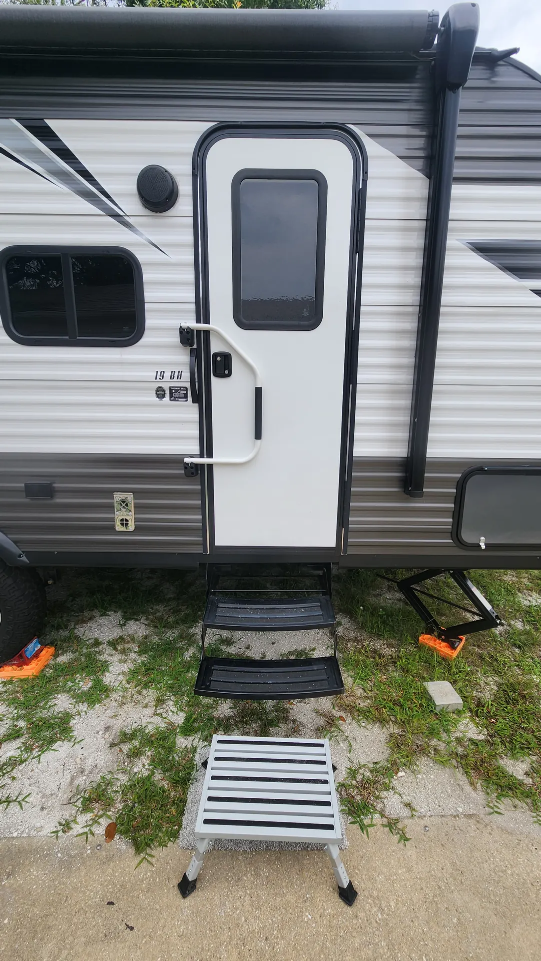 Travel trailer entry door with repaired fold-out steps in Venice, FL